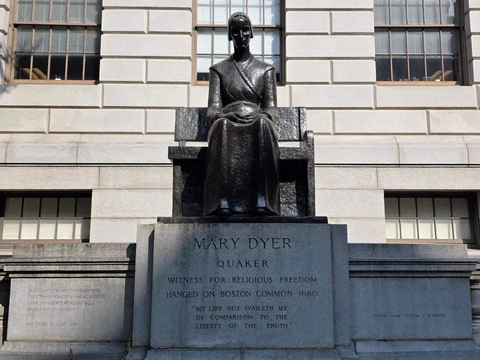 Photo of the Mary Dyer statue in front of the Massachusetts State Capitol building